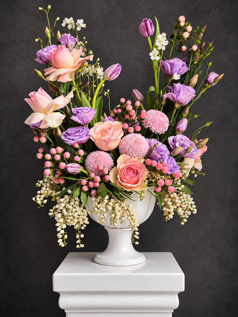 Purple and peachy pink garden style arrangement, featuring roses, tulips and lisianthus
