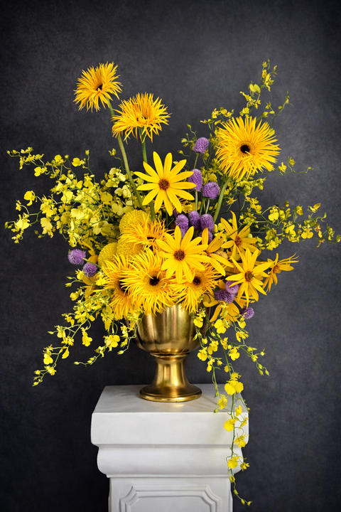 Bright yellow luxurious arrangements with yellow orchids and sunflowers