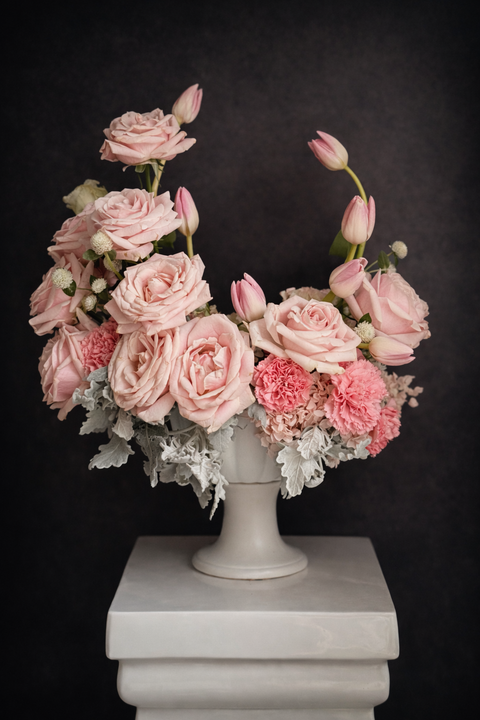 Pink luxurious arrangement with pink roses and pink tulips