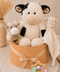 Cow and lamb baby hamper which includes a cow soft plush, a cow rattle and a lamb blanket
