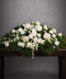 Luxurious white coffin flower spray with roses, orchids, carnations and snapdragons 