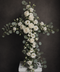 Floral cross arrangement with roses, orchids, lisianthus and eucalyptus