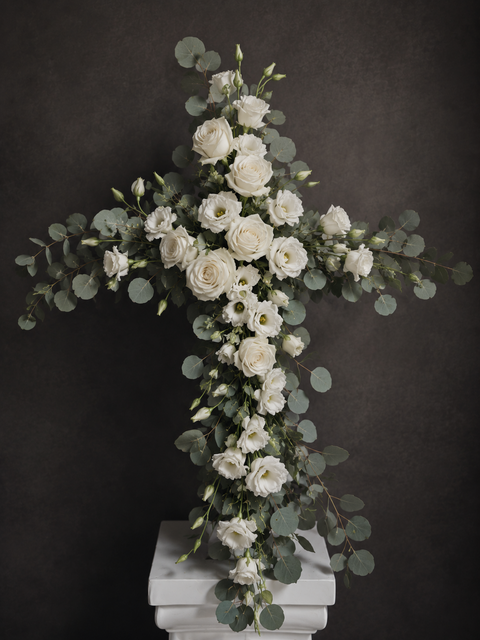 Floral cross arrangement with roses, orchids, lisianthus and eucalyptus